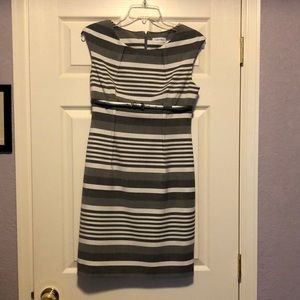 Classic shift with lining,  very tailored,  polyester, rayon, and spandex.